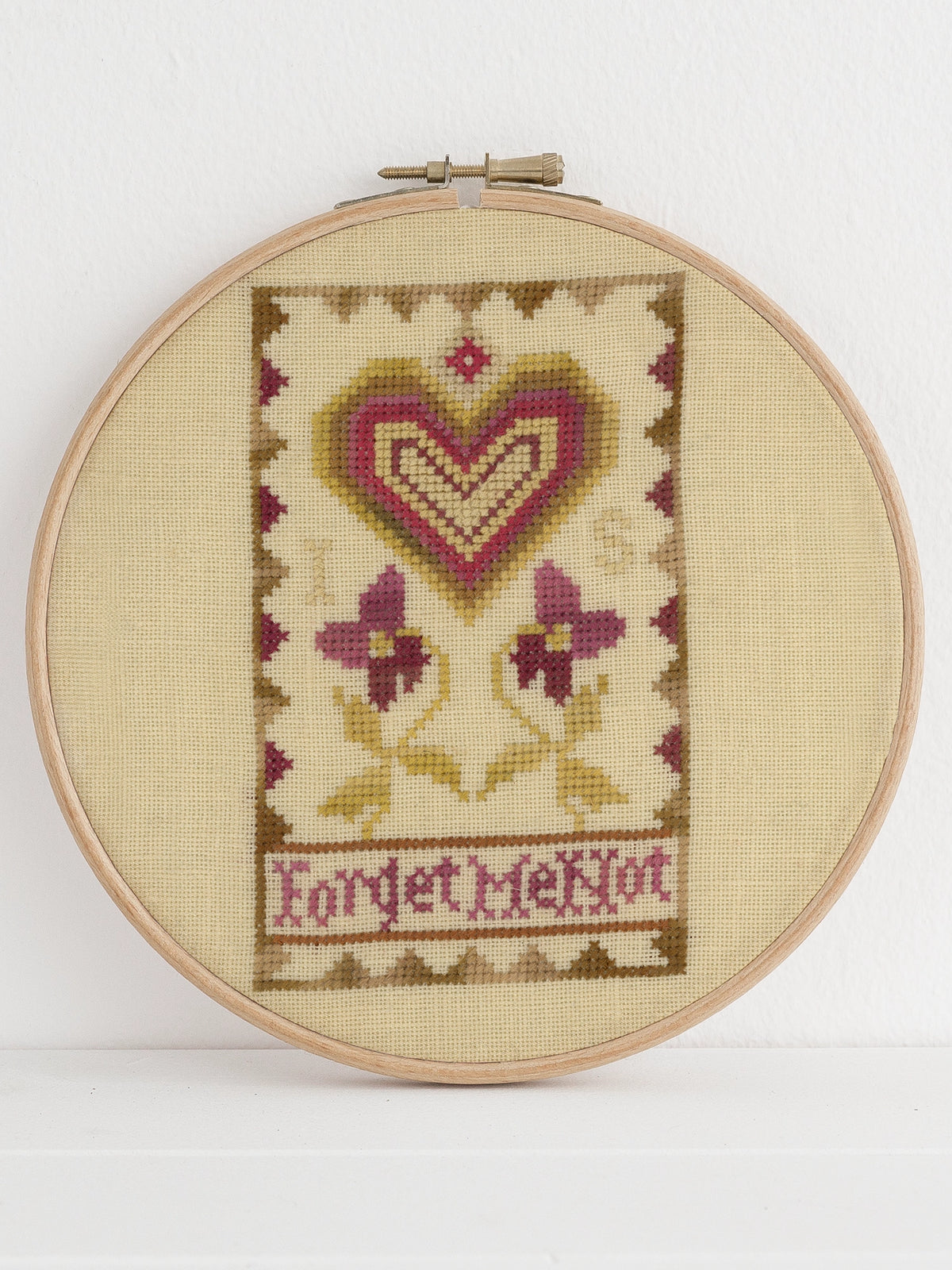 Antique heart sampler motif